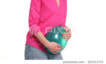 Woman squeezes green ball into body and pain in stomach Woman squeezes green ball into body and pain in stomach 105553757