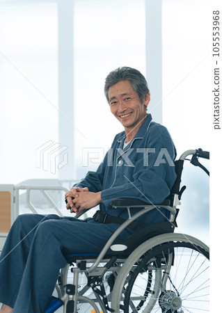 Smiling senior man sitting in a wheelchair 105553968