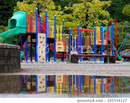 Kanda Park in the morning after the rain (Playground equipment reflected on the surface of the puddle) 105554127