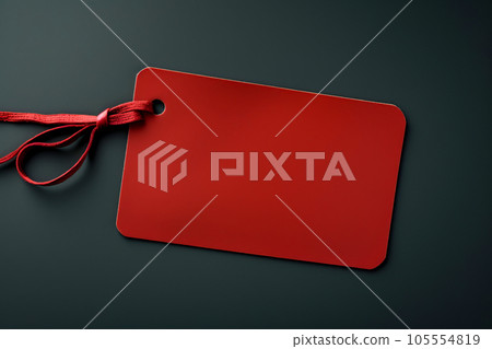 Red empty price tag on black or dark background. Black Friday concept, template copyspace 105554819