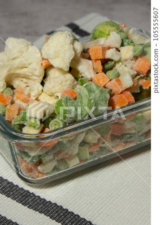 Frozen mixed vegetables for long-term storage. Deep freezing of vegetables. defrosting Frozen food background Frozen mixed vegetables for long-term storage. Deep freezing of vegetables. defrosting Frozen food background 105555607