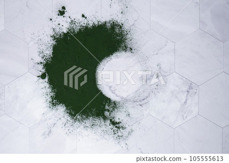 Blue-green algae Chlorella and spirulina powder on table round frame copy space. Super powder. Natural supplement of algae. Detox superfood drink cocktail. Food supplement source of protein and beta Blue-green algae Chlorella and spirulina powder on table round frame copy space. Super powder. Natural supplement of algae. Detox superfood drink cocktail. Food supplement source of protein and beta 105555613