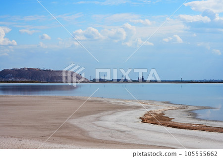 Industrial landscape with toxic lake and pipes 105555662