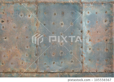 Very old rusted metal sheet with nails 105556567