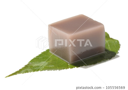 Dice-shaped mizu-yokan on a leaf photographed on a white background Dice-shaped mizu-yokan on a leaf photographed on a white background 105556569