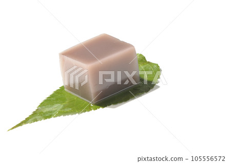 Dice-shaped mizu-yokan on a leaf photographed on a white background Dice-shaped mizu-yokan on a leaf photographed on a white background 105556572