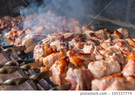 Traditional georgian mtsvadi, grill on the coals with smoke. Shashlik 105557774