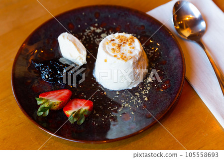 Soft cheese faisselle with strawberry and confiture Soft cheese faisselle with strawberry and confiture 105558693