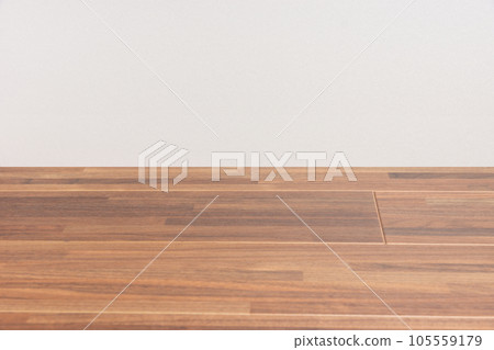 wooden floor and white wall 105559179
