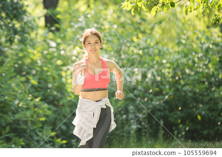 beautiful woman running in the park beautiful woman running in the park 105559694