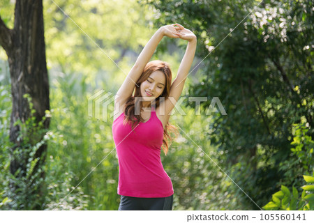 young woman doing yoga in the park young woman doing yoga in the park 105560141