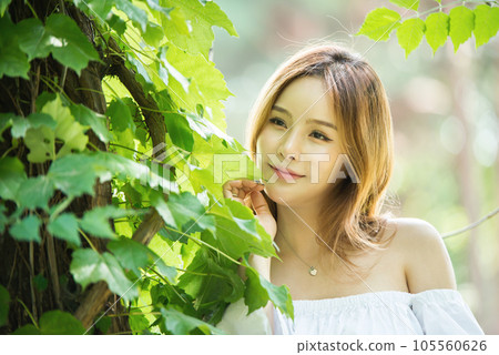 a beautiful woman in the forest a beautiful woman in the forest 105560626
