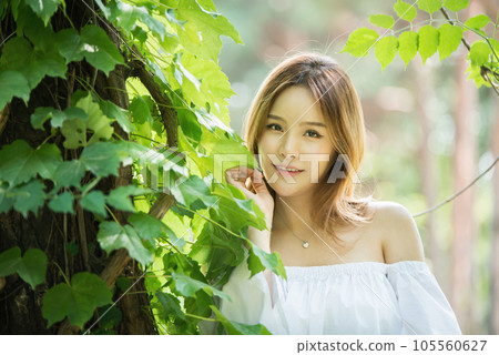 a beautiful woman in the forest 105560627