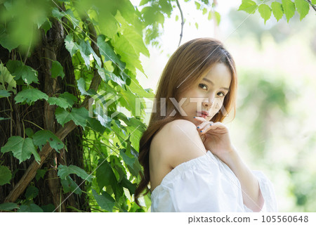 a beautiful woman in the forest a beautiful woman in the forest 105560648