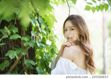 a beautiful woman in the forest a beautiful woman in the forest 105560657