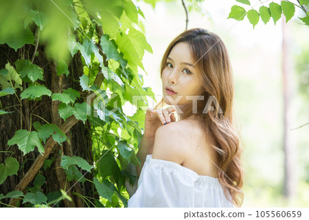 a beautiful woman in the forest 105560659