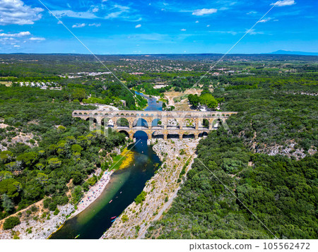 Three-tiered aqueduct Pont du Gard was built in Roman times on the river Gardon and magnificent 105562472