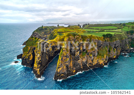Atlantic Ocean surf, rocky coastline and farmlands of Ponta Delgada Atlantic Ocean surf, rocky coastline and farmlands of Ponta Delgada 105562541