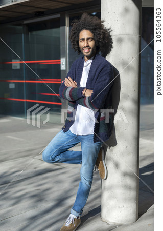 Young african american man smiling happy standing at the city 105564363