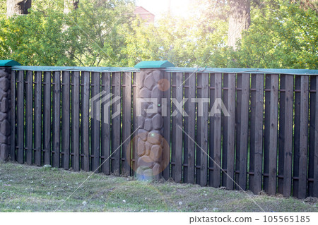 Large metal fence of a private house 105565185