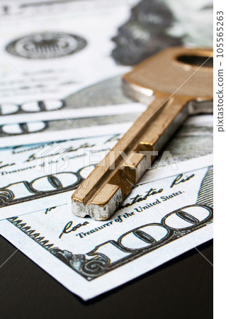 Dollars and key on a black table Dollars and key on a black table 105565263