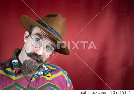 Vintage Hipster man with mustache, glasses, brown hat and asking expression Vintage Hipster man with mustache, glasses, brown hat and asking expression 105565365