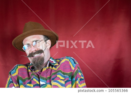 Vintage Hipster man with mustache, hat, glasses and expression of pain and fear Vintage Hipster man with mustache, hat, glasses and expression of pain and fear 105565366
