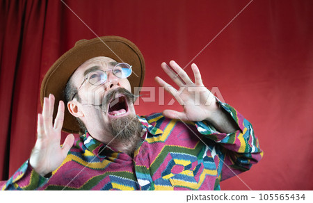 Vintage Hipster terrified man with mustache, hat, glasses and fear face shouting 105565434