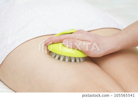 Masseur makes anticellulite massage young woman.  105565541