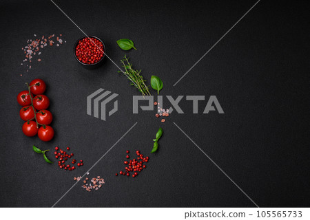 Ingredients for cooking cherry tomatoes, salt, spices and herbs Ingredients for cooking cherry tomatoes, salt, spices and herbs 105565733