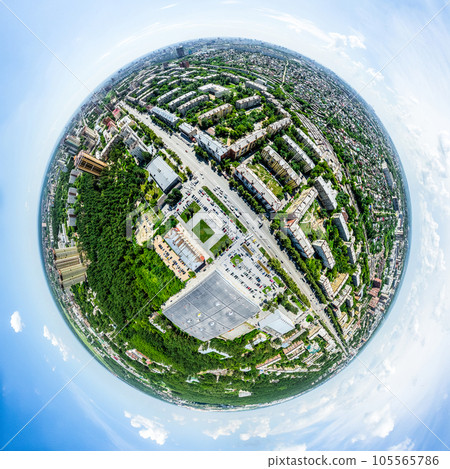 Aerial city view with crossroads and roads, houses, buildings, parks and parking lots. Sunny summer panoramic image 105565786
