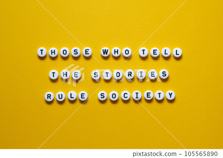 Those who tell the stories rule society - word concept on building blocks, text Those who tell the stories rule society - word concept on building blocks, text 105565890