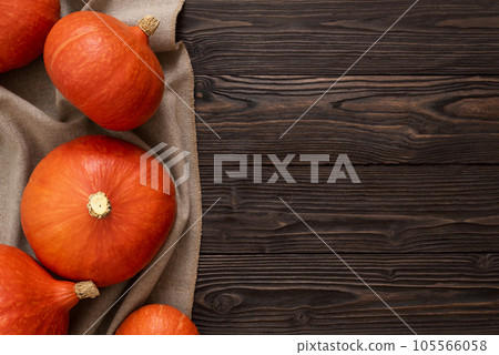 Hokkaido Pumpkin Crop on a Vintage Wooden Background 105566058