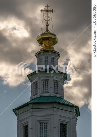 Gilded Orthodox crosses on the domes of the temple against the sky Gilded Orthodox crosses on the domes of the temple against the sky 105566080