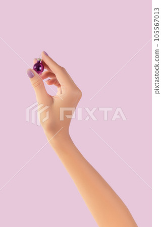 Womans hand with fashionable lavender manicure. Winter christmas nail design 105567013