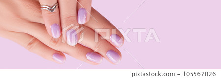 Womans hands with trendy lavender manicure. Spring summer nail design Womans hands with trendy lavender manicure. Spring summer nail design 105567026