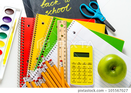 Variety of school supplies on a white background. Variety of school supplies on a white background. 105567027