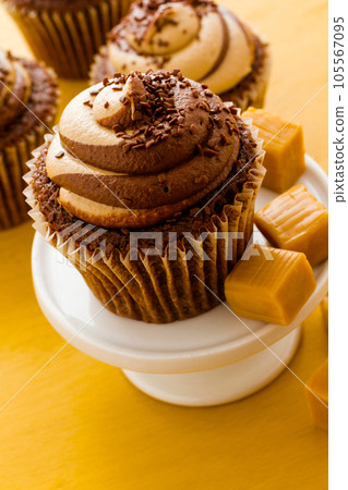 Gourmet chocolate caramel swirl cupcake with chocolate sprikles. Gourmet chocolate caramel swirl cupcake with chocolate sprikles. 105567095