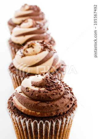 Gourmet chocolate caramel swirl cupcake with chocolate sprikles. Gourmet chocolate caramel swirl cupcake with chocolate sprikles. 105567492