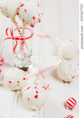 Peppermint chocolate cake pops dipped in white chocolate and candy cane bits. 105567797