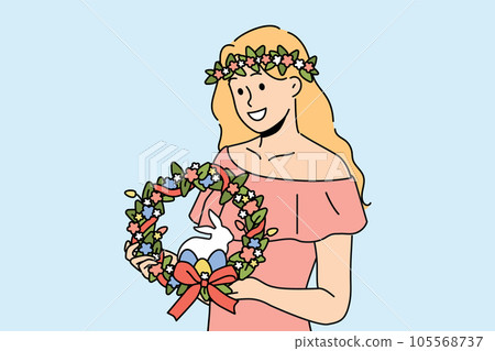 Woman with easter wreath on head smiles and holds colored eggs and miniature rabbit 105568737