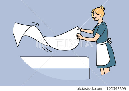 Woman maid makes bed with sheets, preparing hotel room for arrival of new guests 105568899