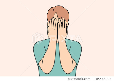 Man closes eyes with hands and peeps, feeling excited in anticipation of surprise or panic 105568908