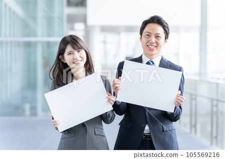 Businessman man and woman with message board Businessman man and woman with message board 105569216