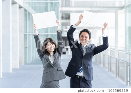 Businessman man and woman with message board Businessman man and woman with message board 105569219