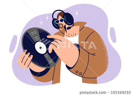 Man hipster holds vinyl record for phonograph, and listens to rare music on headphones. Man hipster holds vinyl record for phonograph, and listens to rare music on headphones. 105569293