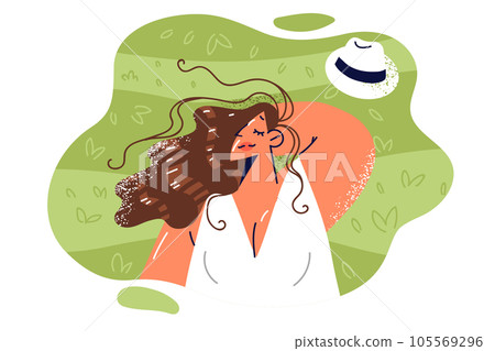 Woman lies on lawn with green grass and enjoys warm sunshine and presence of free time 105569296