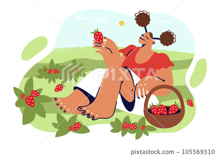 Little girl eats strawberries sitting on lawn with growing berries during summer harvest 105569310