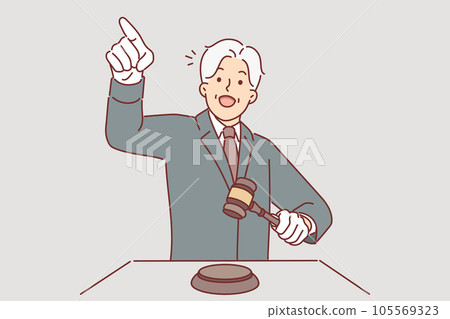 Man auctioneer holds wooden mallet and points finger at potential buyer named lowest price for item 105569323