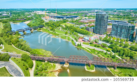 Aerial train bridge and walking bridge over water near Columbus Ohio Aerial train bridge and walking bridge over water near Columbus Ohio 105569739